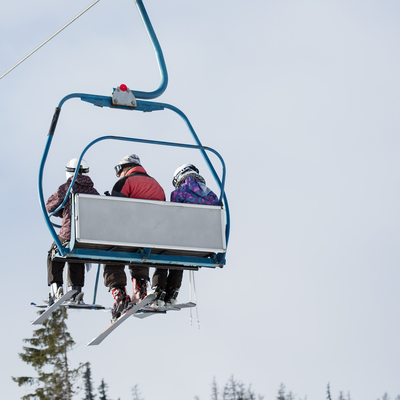 Three skiers on ski lift picjumbo com